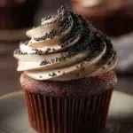 Decadent black cupcakes topped with rich frosting