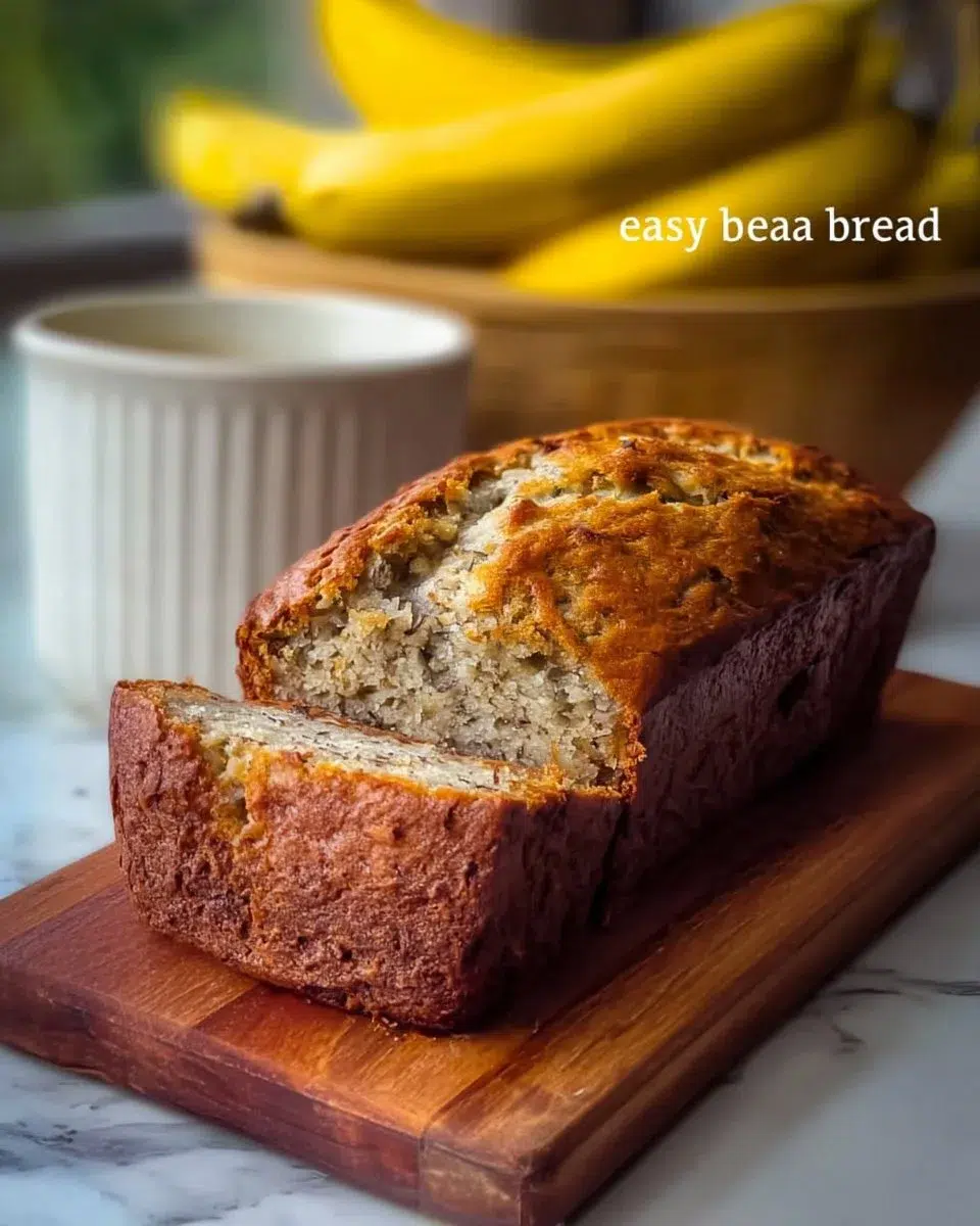 Banana Bread 1 Freshly baked banana bread loaf with sliced bananas on a wooden cutting board
