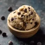 Chocolate chip edible cookie dough for one in a bowl with chocolate chips