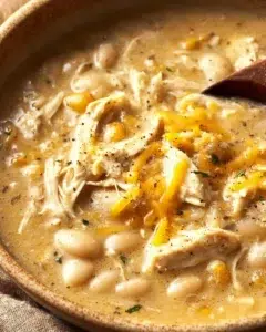 Healthy white chicken chili served in a bowl with toppings