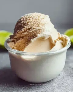 Ninja Creami Protein Ice Cream in a bowl with a scoop and toppings