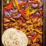 Delicious sheet pan chicken fajitas with colorful peppers and onions