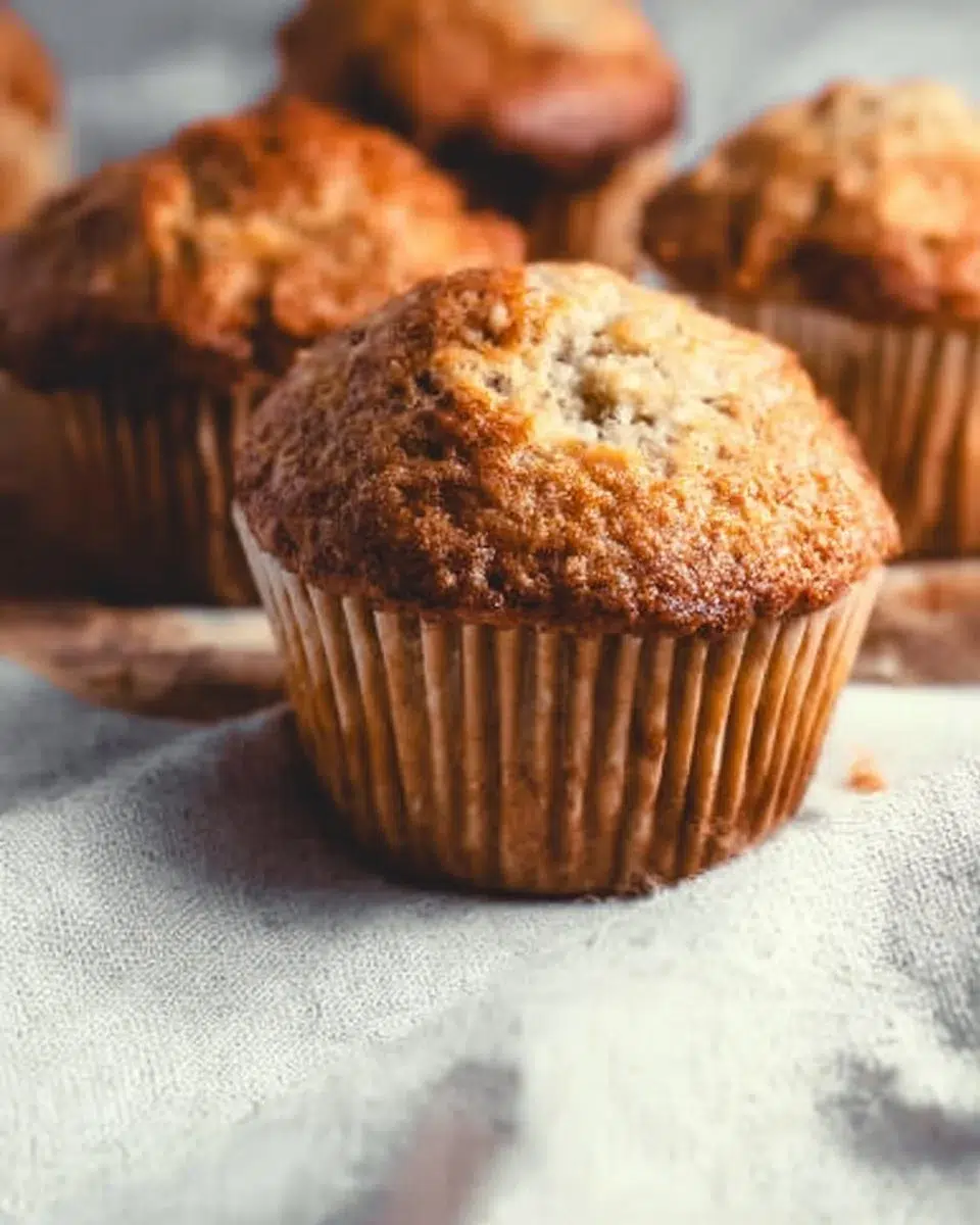 Freshly baked vegan banana muffins on a cooling rack