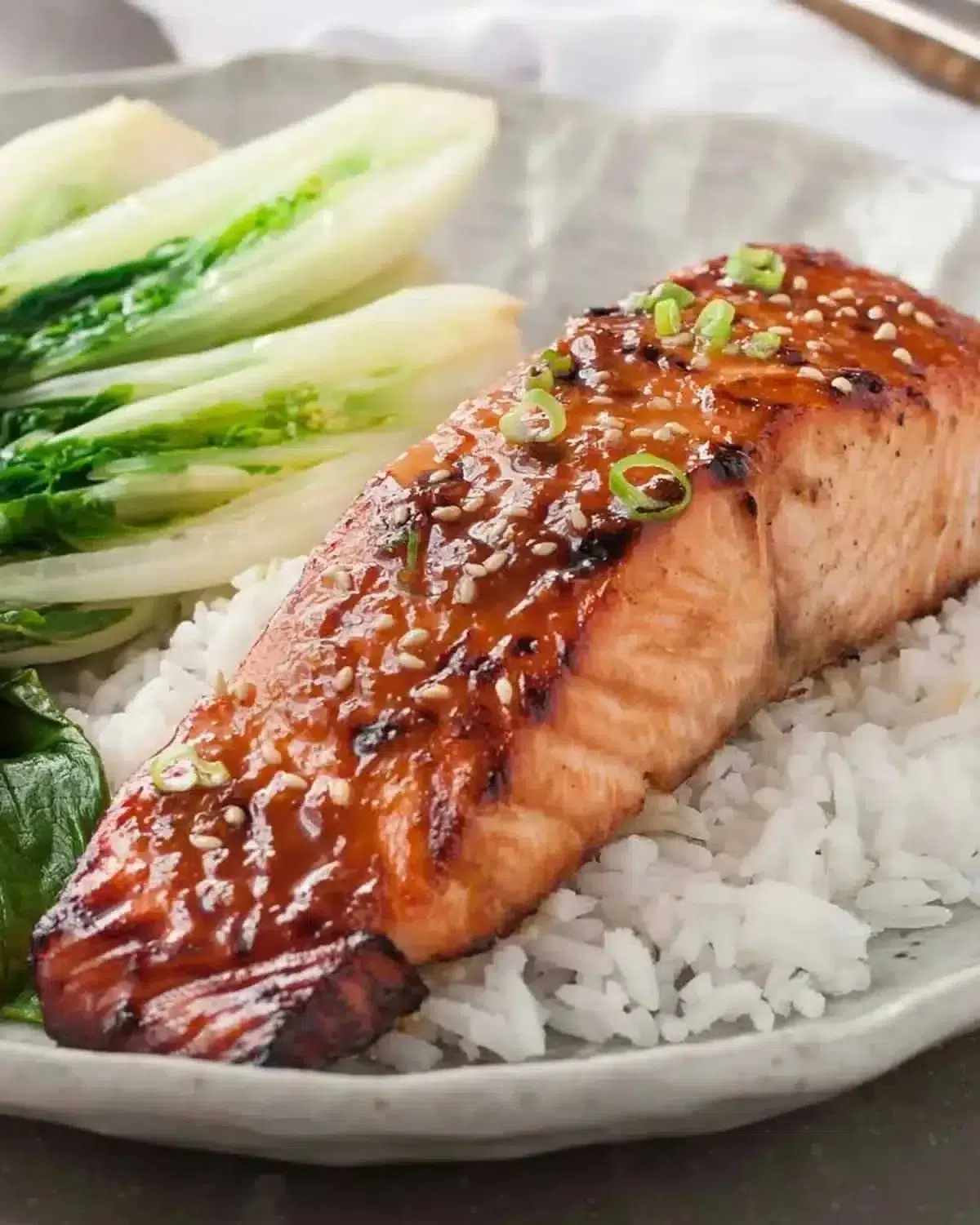 Asian Glazed Salmon | Sticky Maple-Soy Glaze 1 Delicious Asian glazed salmon with a sticky maple-soy glaze garnished for serving