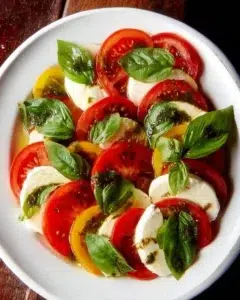 Caprese Salad — Simple Italian Classic 3 Fresh Caprese Salad with tomatoes, mozzarella, and basil drizzled with balsamic