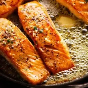Pan-seared fillets with garlic butter served on a plate