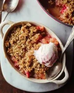 Homemade rhubarb crisp with crumbly topping served in a bowl