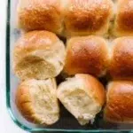 Soft dinner rolls fresh out of the oven, golden brown and fluffy