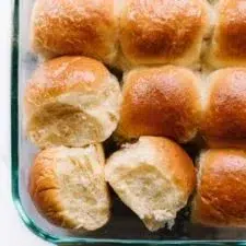 Soft dinner rolls fresh out of the oven, golden brown and fluffy