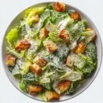 caesar salad recipe hero shot 45 degree angle on bright table