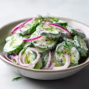cucumber salad recipe hero shot 45 degree angle on bright table