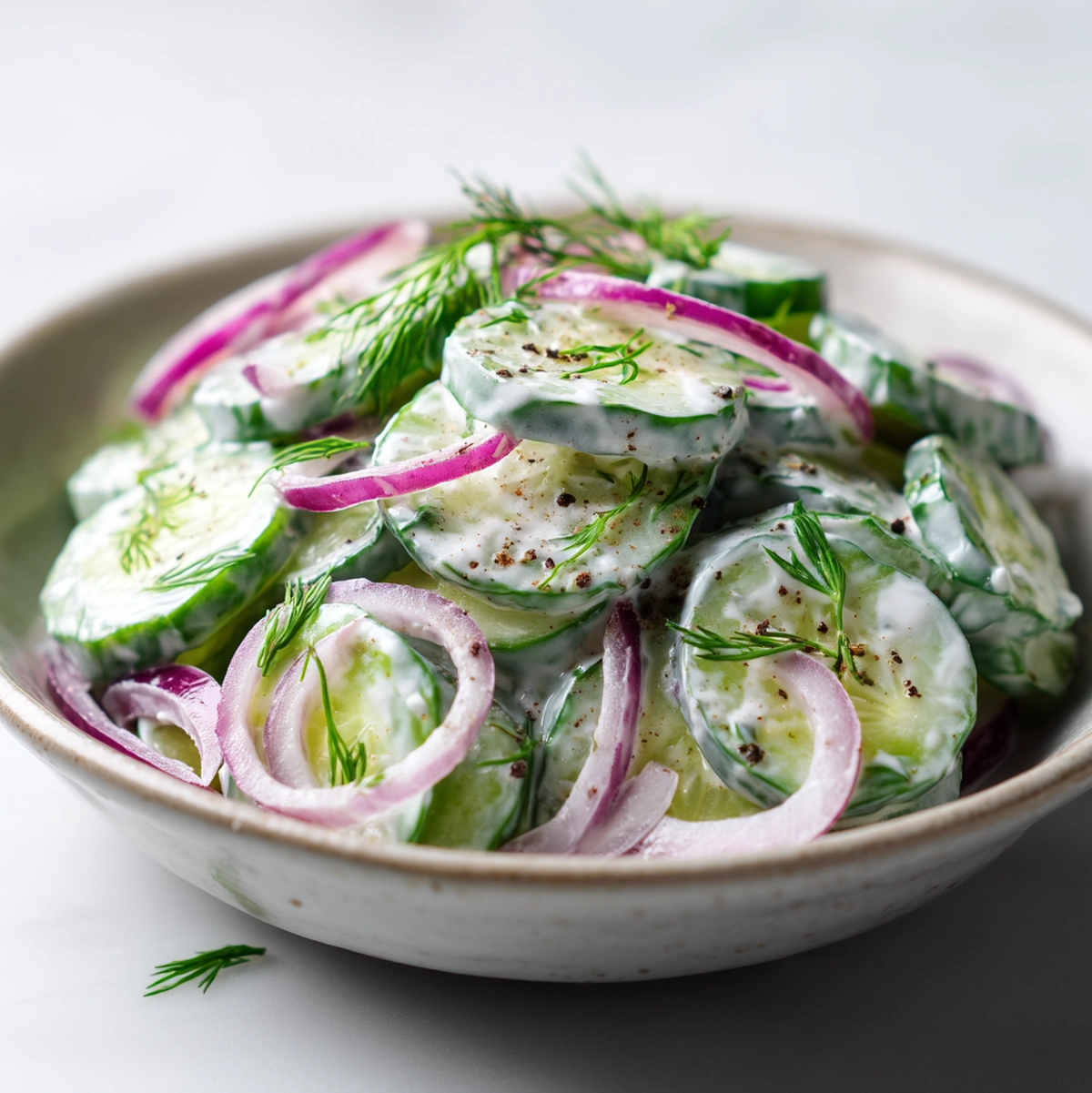 cucumber salad recipe hero shot 45 degree angle on bright table