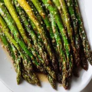 Roasted Asparagus Recipe (Chef-Tested, 5 Foolproof Steps) 10 roasted asparagus recipe hero shot 45 degree angle on bright table