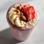 strawberry banana smoothie recipe hero shot 45 degree angle on bright table