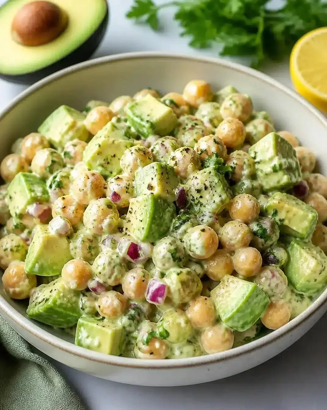 Chickpea and Avocado Salad 1 Chickpea and Avocado Salad garnished with fresh herbs