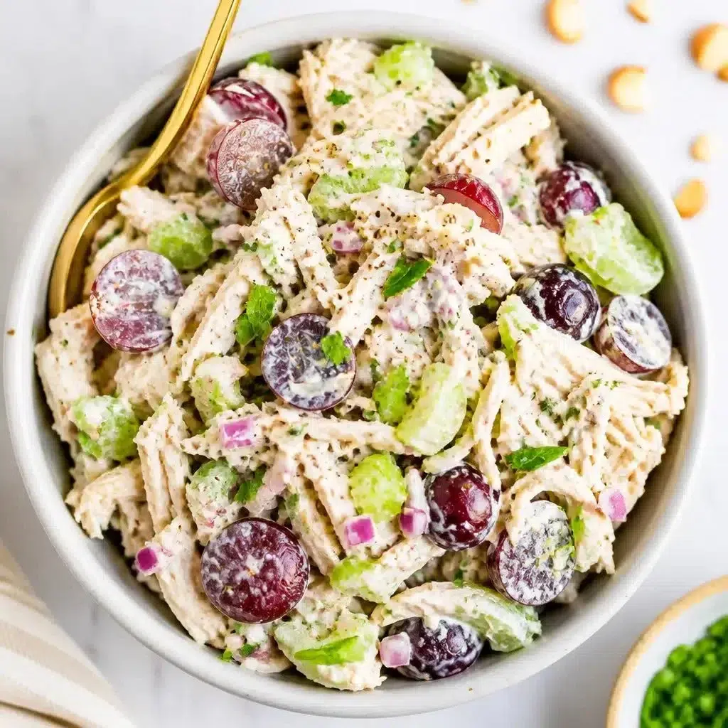 Creamy Greek yogurt chicken salad with fresh ingredients in a bowl.