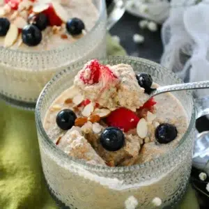 Bowl of egg-free high-protein overnight oats topped with fruits and nuts