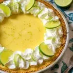 Delicious slice of homemade Key Lime Pie with lime garnish on a plate