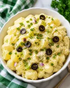 Bowl of ultimate homemade potato salad with herbs and spices