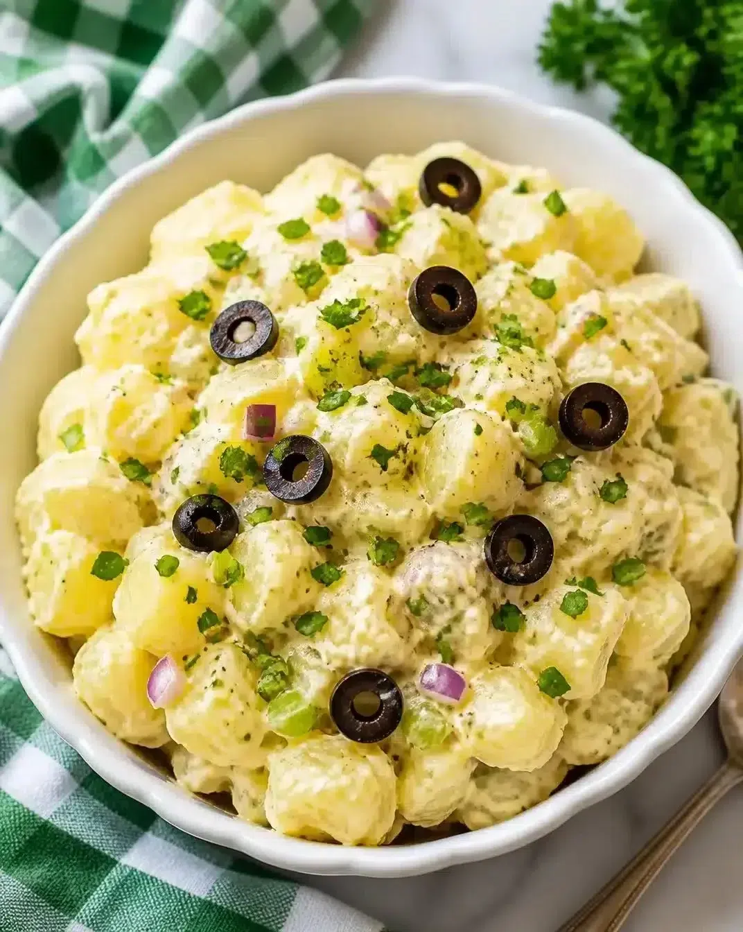 Bowl of ultimate homemade potato salad with herbs and spices