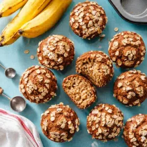 Healthy banana oatmeal muffins stacked on a plate, ideal for breakfast or snacks
