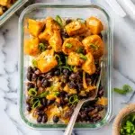 Delicious buffalo chicken rice bowls with tender chicken, veggies, and ranch dressing.