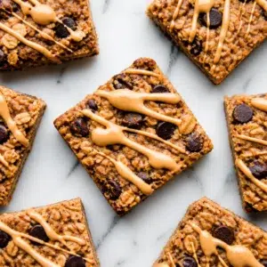 Delicious banana oatmeal breakfast bars, soft-baked and wholesome, ideal for quick snacks.